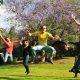 People jumping for joy in a park
