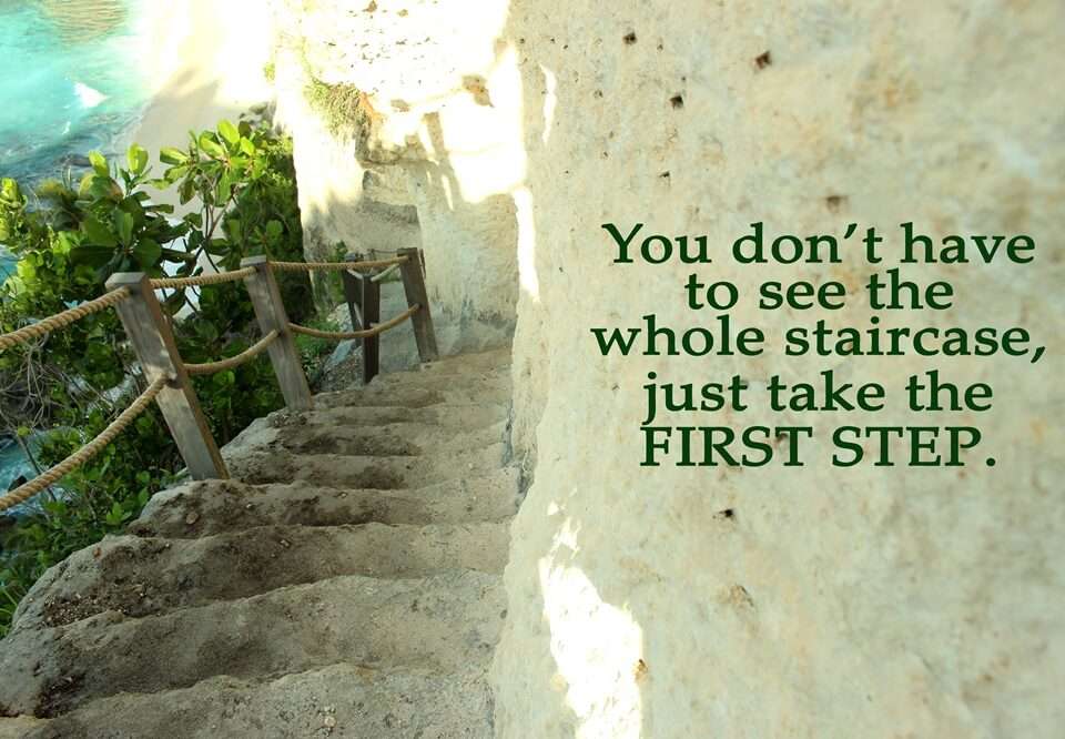 An inspirational quote on an image of a staircase around a rock wall