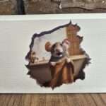 A sticker of a mouse on a skirting board. The mouse is holding a towel in front of a bathtub.