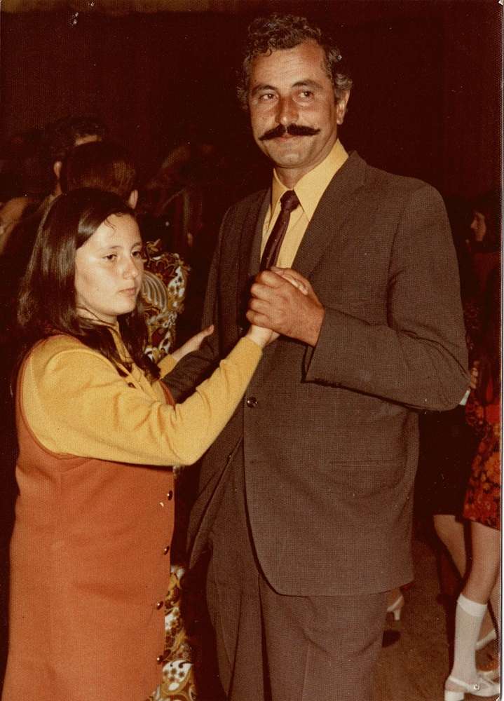 Maria dancing with her father at 10 years of age.