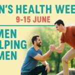 One man sitting and another man offering his hand in help