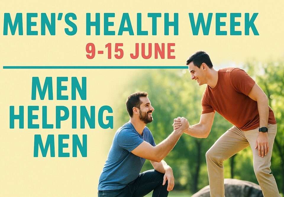 One man sitting and another man offering his hand in help