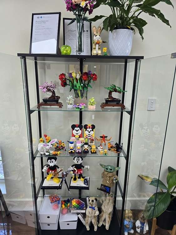 A cabinet at Paragon PsychConnect reception with many Lego pieces done by Angela