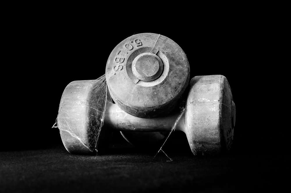 Neglected Dumbbells - Paragon PsychConnect Two gym dumbbells with spider web on them