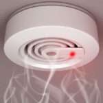 Pain Alarm - Paragon PsychConnect A ceiling smoke alarm with smoke coming out of it